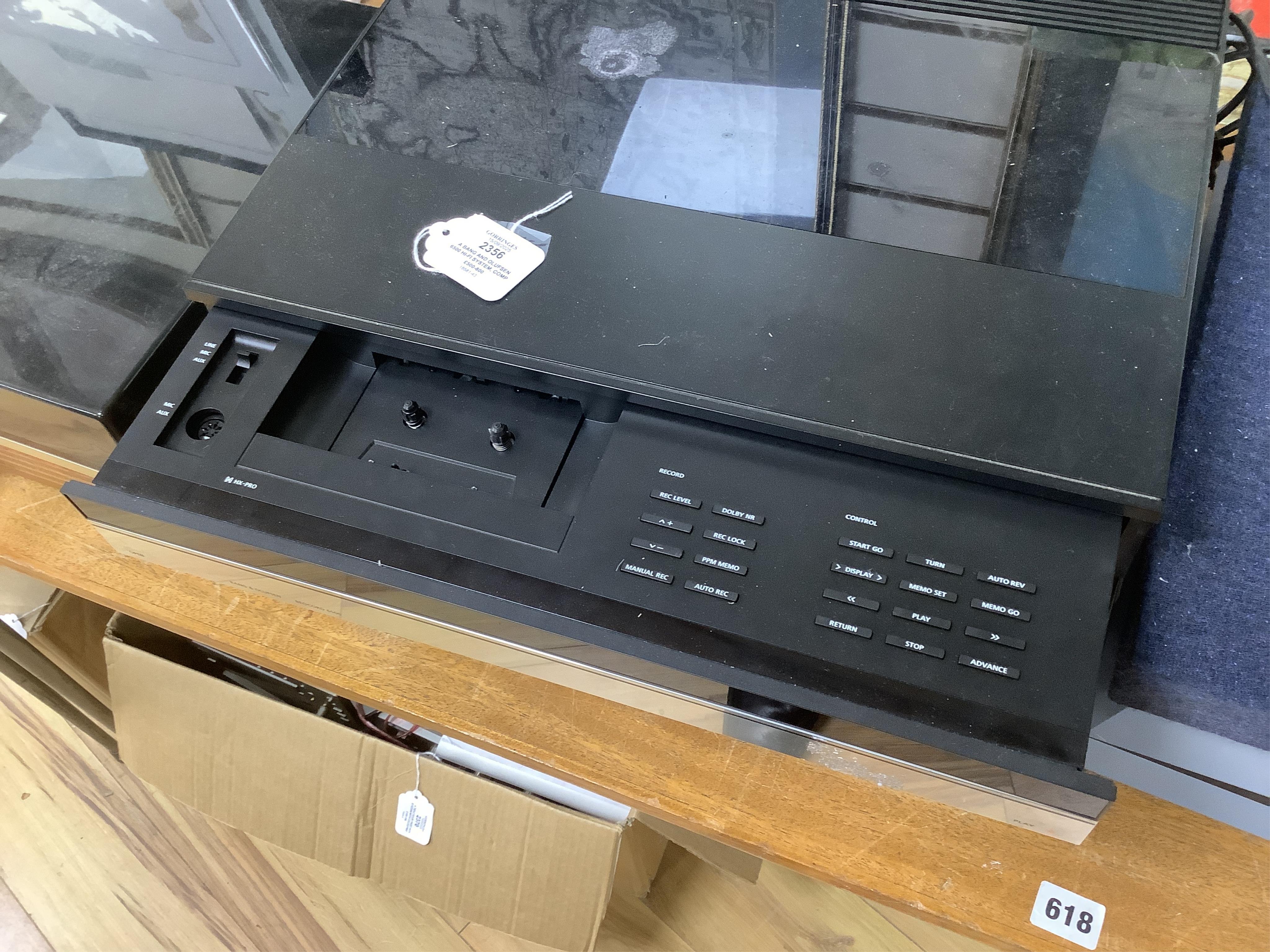 A Bang and Olufsen 6500 hi-fi system, comprising of a Beocord 6500, a Beogram CD 6500, a Beomaster 6500, and a master control panel, together with a pair of floor standing pedestal speakers, 164cm high, and pair of type
